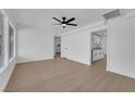 Spacious living room featuring light, wood-look flooring and ceiling fan at 1800 Atlantic St, Las Vegas, NV 89104