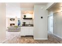 A convenient wet bar features a sink and storage, located near the living area at 2451 N Rainbow Blvd # 2131, Las Vegas, NV 89108
