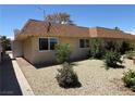 Lovely single-story home with manicured landscaping, neutral colors, and a welcoming curb appeal at 2748 Heritage Cir, Las Vegas, NV 89121