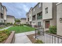 Well-maintained community courtyard with green spaces and inviting walkways at 2845 Copper Wind Ln # 4, Las Vegas, NV 89183