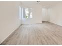 Bright living room boasting natural light, wood-look flooring, and a spacious layout, creating an inviting atmosphere at 4045 Oliver Sagebrush Dr, Las Vegas, NV 89122