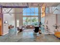 Bright living room with soaring ceilings, large windows and an open floor plan; great for entertaining at 5096 Thunder River Cir, Las Vegas, NV 89148