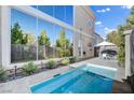 Private pool and spa in backyard, with built-in seating and lush landscaping; perfect for relaxation at 5096 Thunder River Cir, Las Vegas, NV 89148