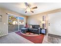Inviting living room featuring a comfortable sofa, large window, and neutral decor at 5710 E Tropicana Ave # 2122, Las Vegas, NV 89122