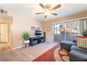 Relaxing living room with stylish furniture, sliding glass doors, and modern decor at 5710 E Tropicana Ave # 2122, Las Vegas, NV 89122