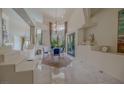 Bright dining room with modern decor and lots of natural light coming through the large windows at 72 Innisbrook Ave, Las Vegas, NV 89113