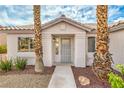 Inviting front entrance showcases the home's charming curb appeal at 7413 Red Eagle St, Las Vegas, NV 89131