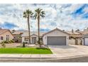 Well-maintained single-story home with a tidy lawn and attractive desert landscaping at 7413 Red Eagle St, Las Vegas, NV 89131
