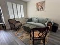 Cozy living room featuring modern furniture, hardwood floors, and a neutral color palette at 10071 Lemon Valley Ave, Las Vegas, NV 89147