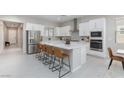 Bright kitchen featuring stainless appliances, center island, breakfast bar and modern finishes at 10251 Tiger Milkweed St, Las Vegas, NV 89141