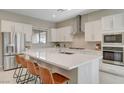 Stylish kitchen features a large island with seating, sleek stainless steel appliances, and ample counter space at 10251 Tiger Milkweed St, Las Vegas, NV 89141