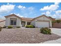 Charming single-story home featuring a low-maintenance desert landscape and attached two-car garage at 10809 Clarion Ln, Las Vegas, NV 89134