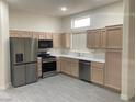 Bright kitchen features stainless steel appliances and neutral cabinetry at 10809 Clarion Ln, Las Vegas, NV 89134
