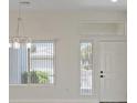 Bright living room featuring neutral paint and hardwood flooring at 10809 Clarion Ln, Las Vegas, NV 89134