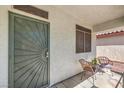 Charming front porch with seating area, perfect for relaxing and enjoying the outdoors at 11143 Castellane Dr, Las Vegas, NV 89141