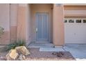 Charming front door with a modern design, enhancing curb appeal and security of this inviting home at 11369 Rancho Villa Verde Pl, Las Vegas, NV 89138
