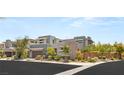 Modern style home with desert landscaping showcasing clean architectural lines and neutral color palette at 15 Gemstar Ln, Las Vegas, NV 89135