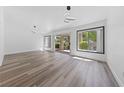 Bright and airy living room with wood-look flooring and a sliding glass door at 2208 Spring Water Dr, Las Vegas, NV 89134