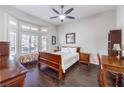 Cozy bedroom featuring a large window and ample natural light with wood-style floors at 2330 Spring Water Dr, Las Vegas, NV 89134
