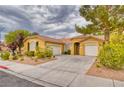 Inviting single-story home with attached two-car garage and well-maintained landscaping at 2383 Rainswept Ave, Henderson, NV 89052