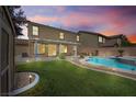 Spacious backyard with a well-manicured lawn, an inviting pool, and patio perfect for outdoor enjoyment at 248 Hyssop Ct, Henderson, NV 89015