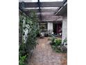Charming courtyard patio area with tile floors, a hammock, and comfortable seating at 2484 Domingo St, Las Vegas, NV 89121