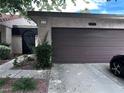 Charming home featuring a front lawn, two-car garage, and well-maintained landscaping at 2484 Domingo St, Las Vegas, NV 89121