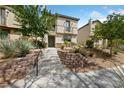 Charming two-story home with desert-friendly landscaping and an inviting entrance at 2606 Marvel Astoria St, Henderson, NV 89044