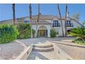Beautiful home with a paver walkway leading to the front door and a well-maintained landscape at 2771 S Buffalo Dr, Las Vegas, NV 89117