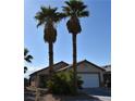 View of a single-story home with desert landscaping, complemented by a bright blue sky at 2845 Kensington St, Las Vegas, NV 89156