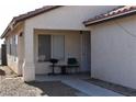 Cozy front porch seating area featuring two chairs and tile flooring at 2845 Kensington St, Las Vegas, NV 89156