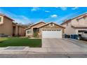 Charming single-story home with a two-car garage and well-maintained lawn at 2903 Galena Peak Ln, Las Vegas, NV 89156