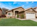 Charming single-story home with a two-car garage and well-maintained lawn at 2903 Galena Peak Ln, Las Vegas, NV 89156