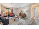 Open living area features modern furniture, neutral decor, and plenty of natural light from the sliding glass door at 3151 Soaring Gulls Dr # 1145, Las Vegas, NV 89128