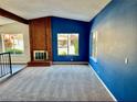 Bright living room with cozy fireplace, and neutral carpet flooring at 3729 La Junta Dr, Las Vegas, NV 89120