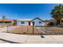 Charming single-story home with a red front door and a low-maintenance desert landscape at 4360 El Tovar Rd, Las Vegas, NV 89115
