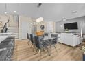 Elegant dining space with modern lighting fixtures and contemporary decor at 4465 Shimmering Skies St # 1177, North Las Vegas, NV 89031