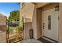 Welcoming front entrance with gated access and a charming door, offering privacy and curb appeal at 506 Chestnut View Pl, Henderson, NV 89052