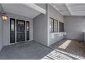 View of covered front porch with decorative glass in the front door at 5162 Somerset Dr, Las Vegas, NV 89120
