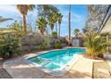 Relaxing pool with surrounding patio, mature landscaping, and convenient access at 6223 Foothill Blvd, Las Vegas, NV 89118