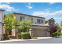 Charming two-story home featuring stone accents, a well-manicured lawn, and a spacious two-car garage at 6731 Sumatra St, Las Vegas, NV 89166