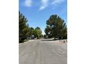 Residential street with mature trees offering a quiet and picturesque setting at 7650 Butterscotch Ct, Las Vegas, NV 89131