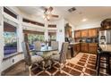 Cozy breakfast nook with large windows offering views of the backyard next to the updated kitchen at 884 E Robindale Rd, Las Vegas, NV 89123