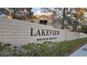 Lakeview signage on brick wall with landscape in front. Features community name and street number at 9070 Spring Mountain Rd # 209, Las Vegas, NV 89117