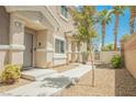 Charming single-Gathering home with desert landscaping, a walkway, and a welcoming front door at 9490 Thunder Sky St # 102, Las Vegas, NV 89178