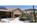 Backyard featuring a covered patio, gazebo, beautiful landscaping, and outdoor seating providing a relaxing space at 10015 Wonderful Day Dr, Las Vegas, NV 89148
