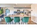 This kitchen offers an expansive island, stainless appliances and ample storage space at 1433 Gable Falls Pl # 95, North Las Vegas, NV 89084