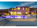 Gorgeous backyard pool with adjacent patio, dining area, and outdoor kitchen perfect for entertaining friends and Gathering at 2153 King Crest Ct, Henderson, NV 89052