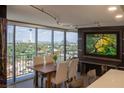 Bright dining room with city views, with wood table and seating for six at 3111 Bel Air Dr # 15G, Las Vegas, NV 89109