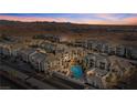Aerial view of condo community with swimming pool, parking and mountain views at 3550 Bay Sands Dr # 1003, Laughlin, NV 89029